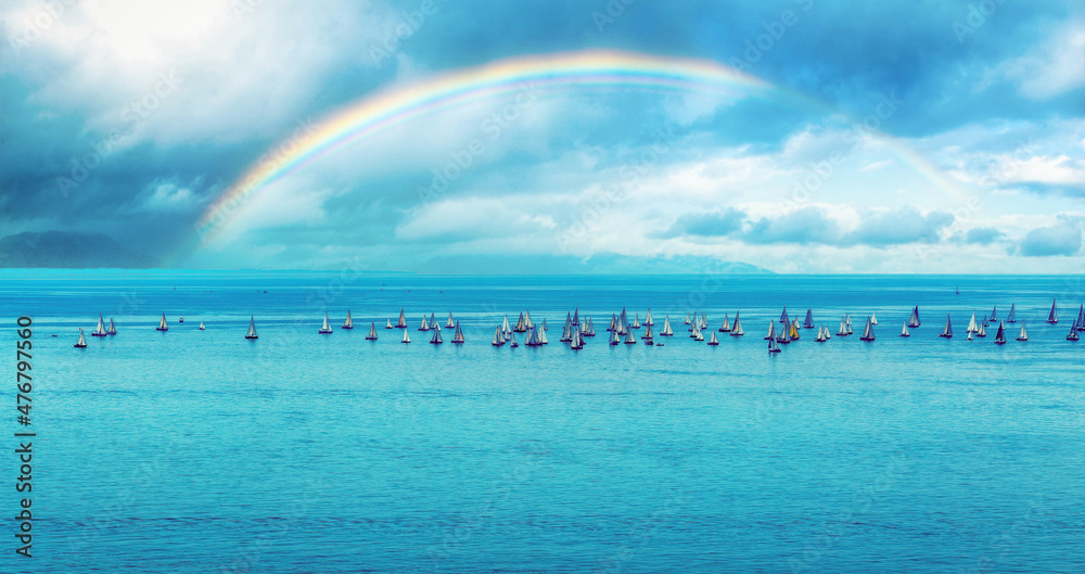 sailboat at sea, rainbow in the background. sailboat at sea, rainbow in the background.