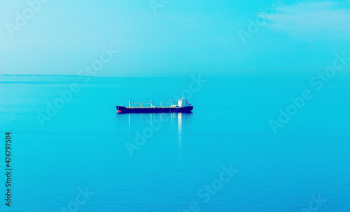 Large container ship in the open sea. © jozefklopacka