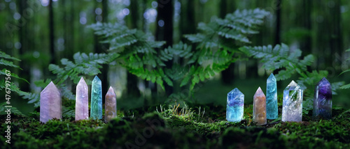 quartz Gemstones on mysterious forest natural background. minerals for esoteric Magic crystal Ritual, Witchcraft, spiritual practice. reiki healing therapy for life balance, soul relax.