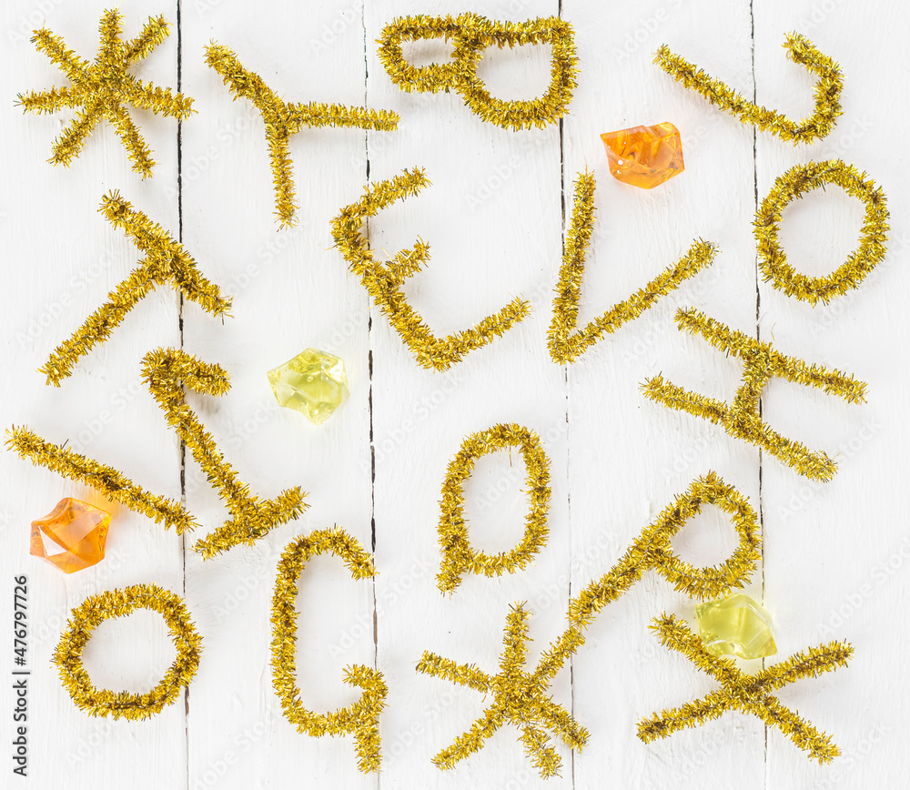 letters and snowflakes made of tinsel for Christmas holidays letters and snowflakes made of tinsel for Christmas holidays