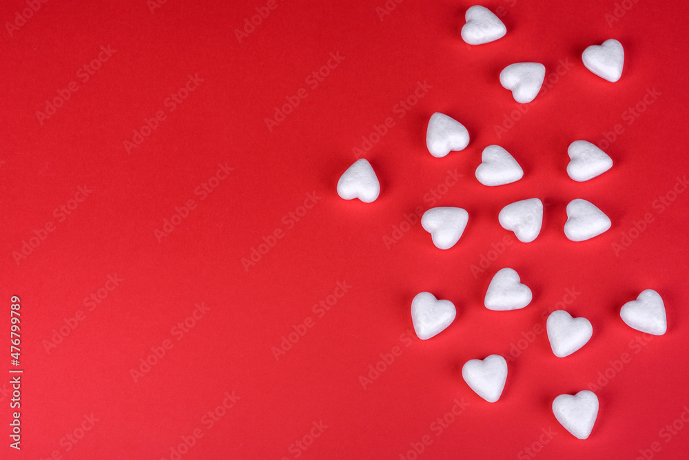 Several figures in the shape of hearts on a red one-ton background Several figures in the shape of hearts on a red one-ton background