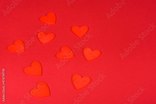 Several figures in the shape of hearts on a red one-ton background