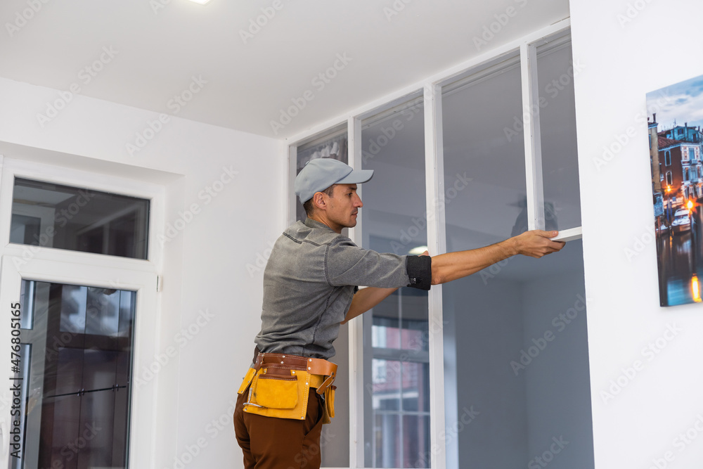 young fixer doing plasterboard partitioning young fixer doing plasterboard partitioning