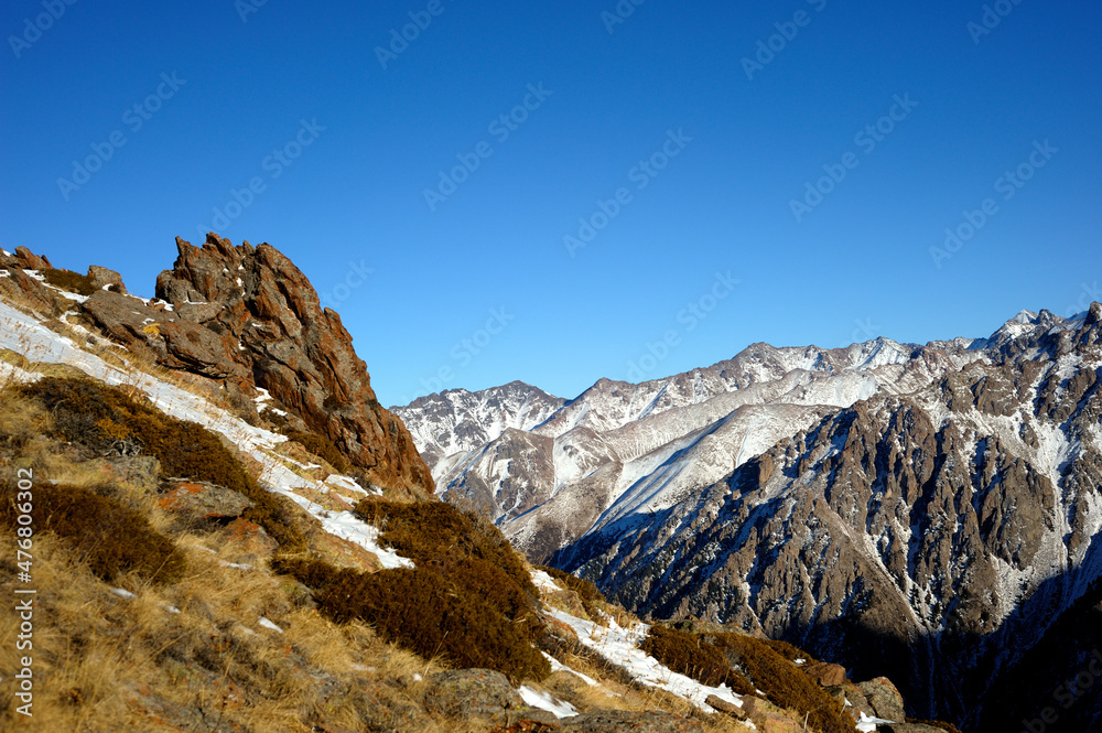 Majestic mountain peaks covered with snow (altitude: over 3200 meters). Ile Alatau, also spelt as Trans-Ili Alatau, etc., is a part of the Northern Tian Shan mountain system in Kazakhstan