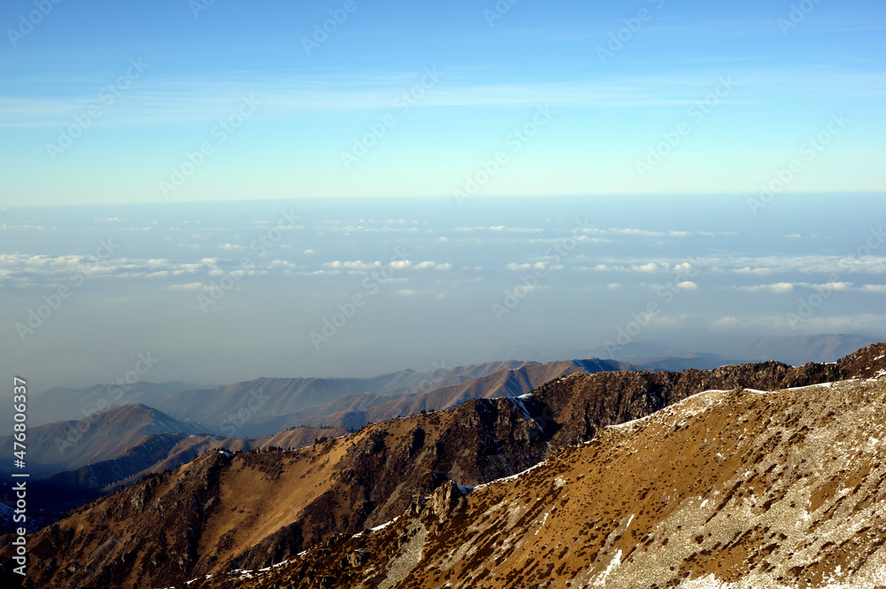 Obraz premium Majestic mountain peaks covered with snow (altitude: over 3200 meters). Ile Alatau, also spelt as Trans-Ili Alatau, etc., is a part of the Northern Tian Shan mountain system in Kazakhstan