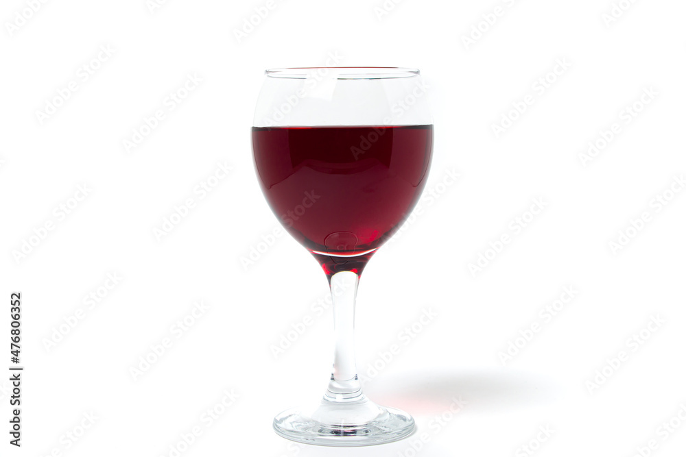 Glass of red wine on a white background. Alcoholic drink.