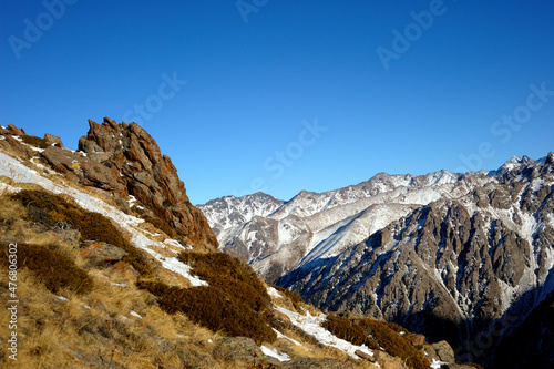 Majestic mountain peaks covered with snow (altitude: over 3200 meters). Ile Alatau, also spelt as Trans-Ili Alatau, etc., is a part of the Northern Tian Shan mountain system in Kazakhstan