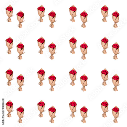 Bouquets of red roses in craft paper on a white background.