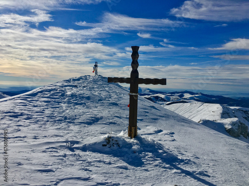 cross in the mountains, Bucura Dumbrava Peak, Bucegi Mountains, Romania 
 photo