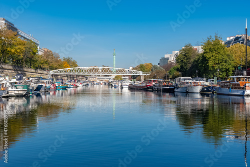 Paris, Bastille, beautiful harbor with houseboats, and the column with the angel 