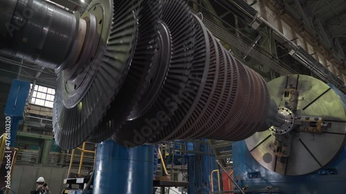 Turbine Manufacturing Facility. The Part of the Turbine is Spinning while it is Attached to the testing stand. Steam Turbine Assembly Process. Heavy Machinery. Industrial Plant. Production Process. photo