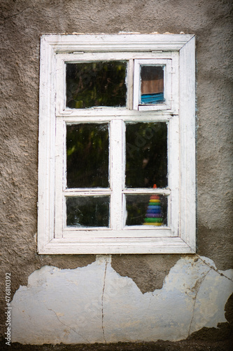 Old white window on an old house
