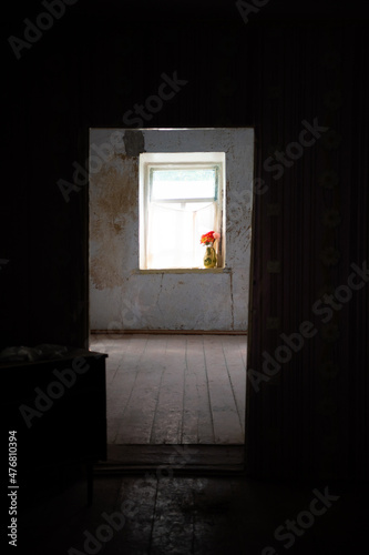 Light from a white window in a dark hallway