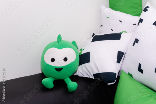 Soft toy next to the pillows