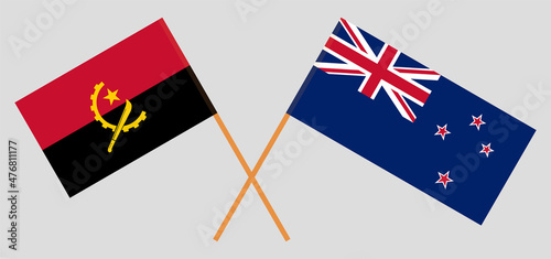 Crossed flags of Angola and New Zealand. Official colors. Correct proportion