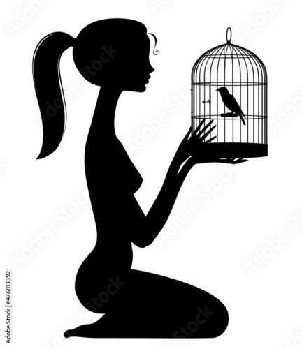 Black silhouette of a sitting lovely naked girl holding a cage with a bird in her hands