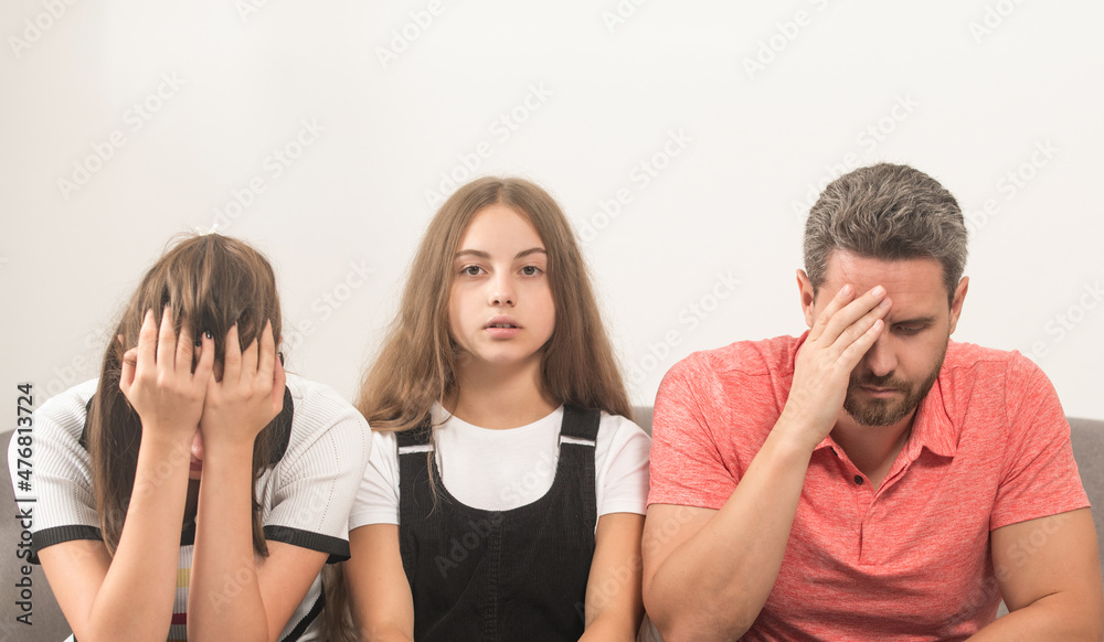 sad child between mother and father. family therapy. parents with kid having problems.