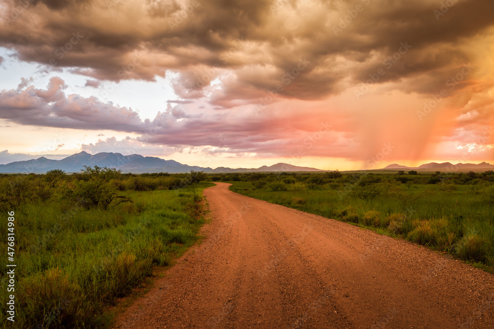 Vibrant sunset in Sonoita Arizona, road leading into the distance. 