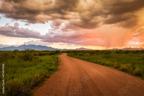 Vibrant sunset in Sonoita Arizona, road leading into the distance.  © mdurson