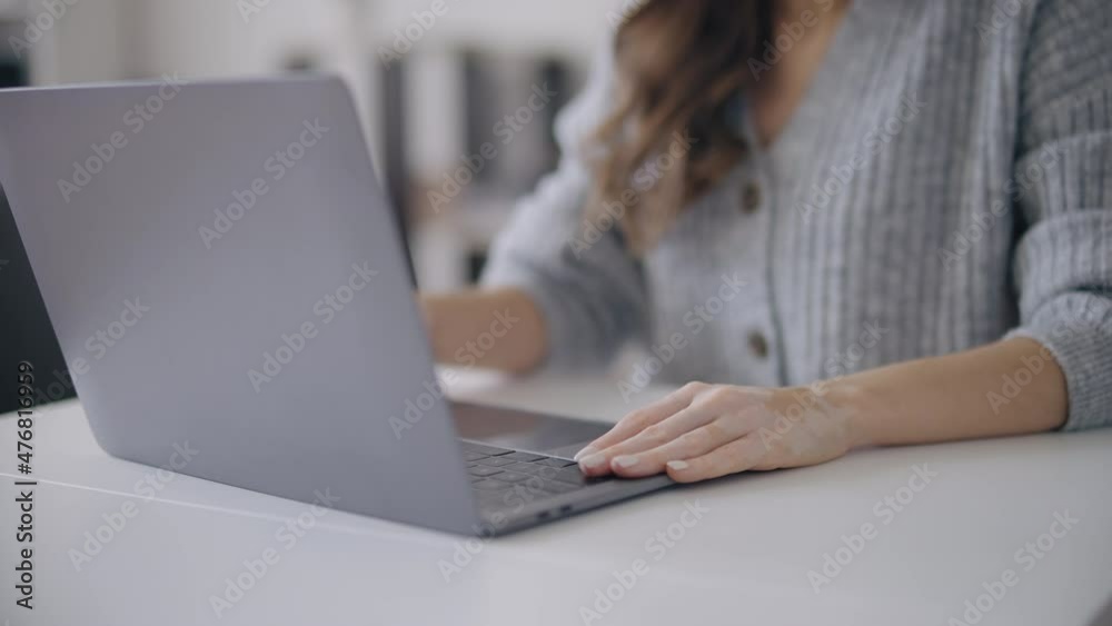 Woman with skin pigmentation disorder closing laptop, freelancer finishing work Woman with skin pigmentation disorder closing laptop, freelancer finishing work