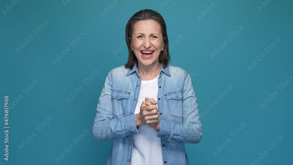Overjoyed lady win million dollars fist up isolated blue color background Overjoyed lady win million dollars fist up isolated blue color background