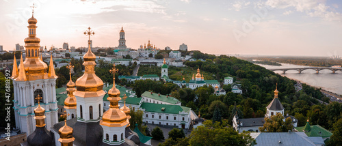 Magical aerial view of the Kiev Pechersk Lavra near the Motherland Monument. UNESCO world heritage in Kyiv, Ukraine. Kiev Monastery of the Caves at sunset.