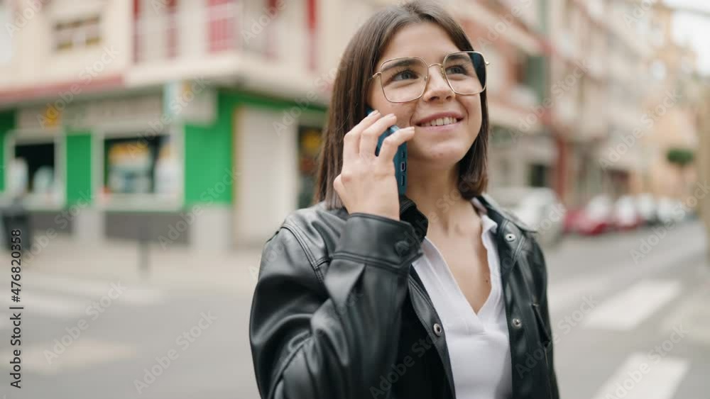 Young hispanic woman smiling confident talking on the smartphone at street Young hispanic woman smiling confident talking on the smartphone at street