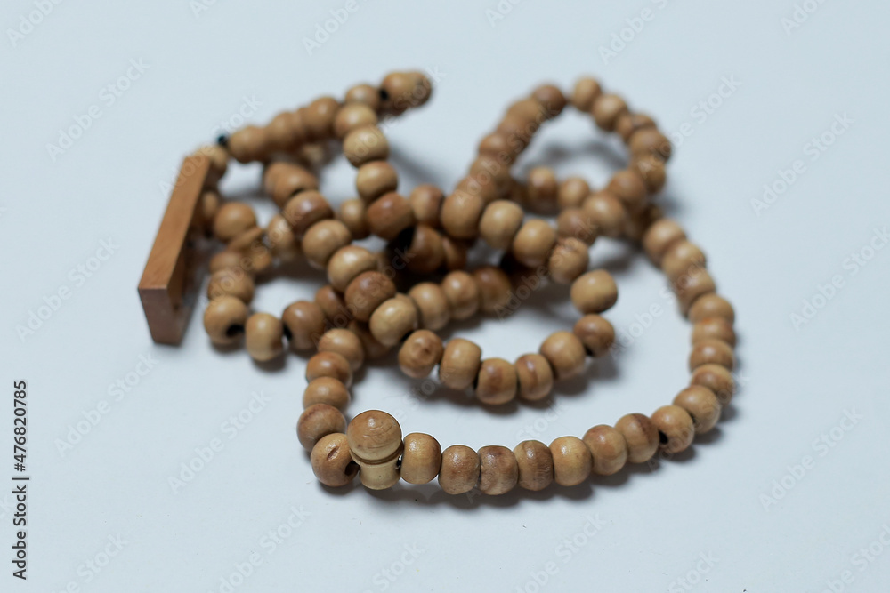 Prayer beads made of wood white background Prayer beads made of wood white background