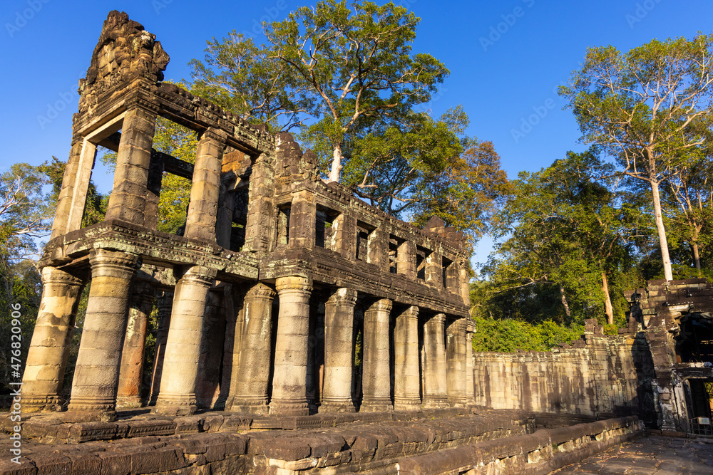 Ruins of Preah Khan temple in Angkor complex, overgrown by trees, Cambodia