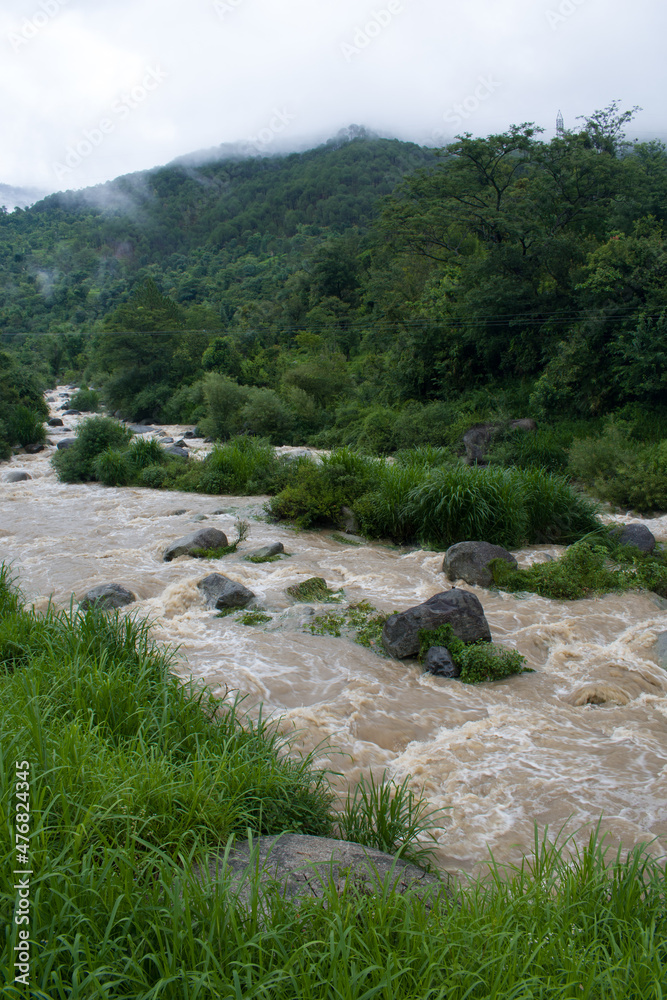 River flooded in monsoon rainy season in mountainous region