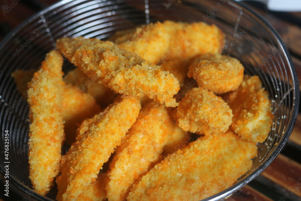 Freshly ripe fried bananas with a brown color made with bananas dipped in a mixture of liquid flour and breadcrumbs Freshly ripe fried bananas with a brown color made with bananas dipped in a mixture of liquid flour and breadcrumbs