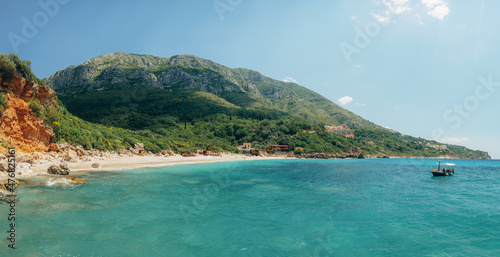 View from the sea to the Drobni Pijesak beach at the foot of the mountain