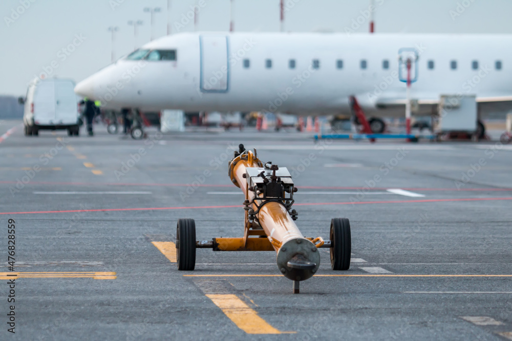 Towbar for pushback airplanes at the airport apron
