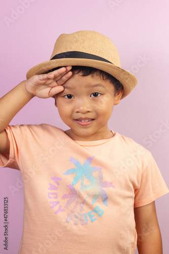 Close-up portrait of asian child boy he nice-looking creating new idea solution fantasize copy space isolated pink color background