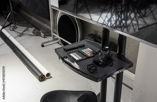 Interior of a modern photo studio. Technics and equipment. Flashmeter and TV