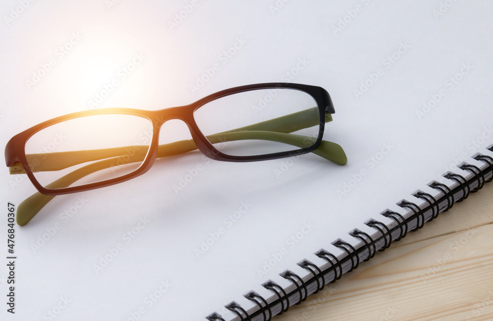 glasses on book , reading a book for the exam glasses on book , reading a book for the exam