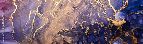 Luxury abstract background in alcohol ink technique  indigo blue gold liquid painting  scattered acrylic blobs and swirling stains  printed materials.