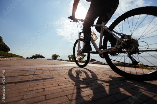Riding bike on the sunrise coast path © lzf