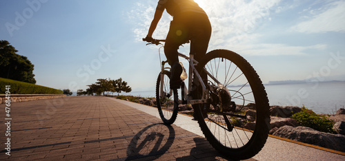 Riding bike on the sunrise coast path