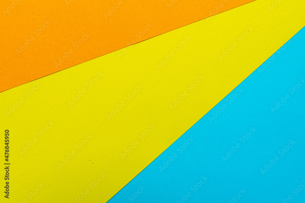 Orange yellow and blue paper texure top view for background