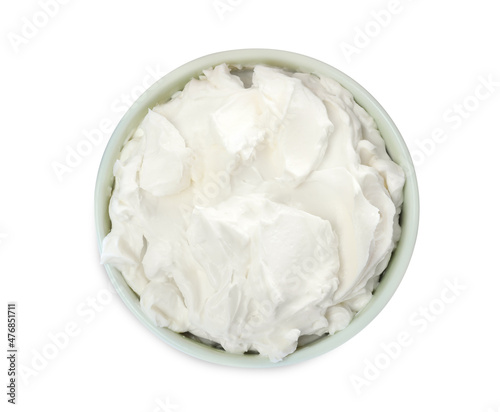 Bowl of tasty cream cheese isolated on white, top view