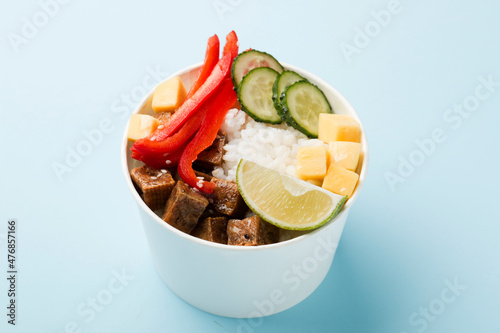 Poke bowl, lunch bowl with fresh vegetables and rice. 
