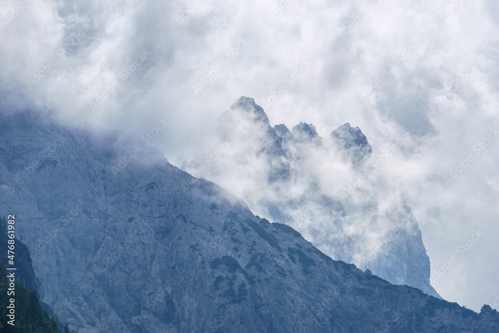 Clouds in front of mountain peak in Julian Alps, Triglav National Park, Slovenia