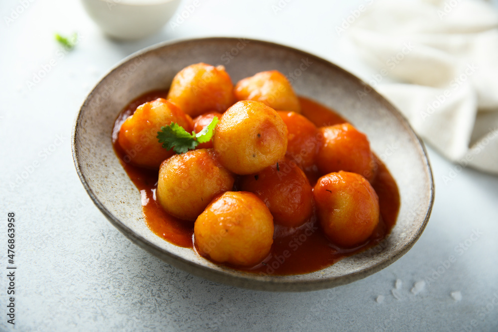 Traditional homemade dumplings with tomato sauce Traditional homemade dumplings with tomato sauce
