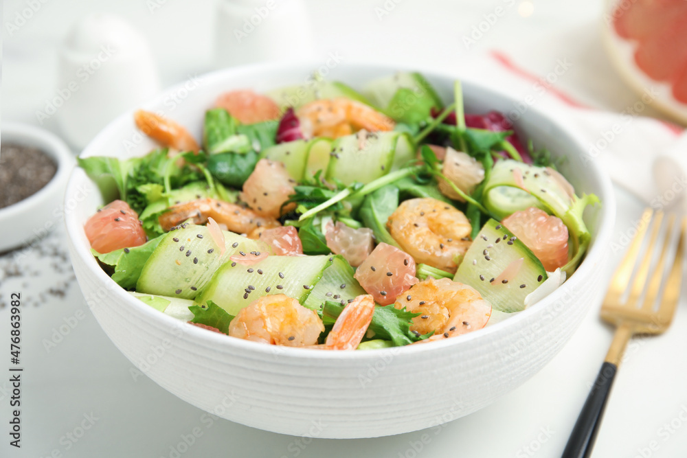 Delicious pomelo salad with shrimps served on white table, closeup Delicious pomelo salad with shrimps served on white table, closeup