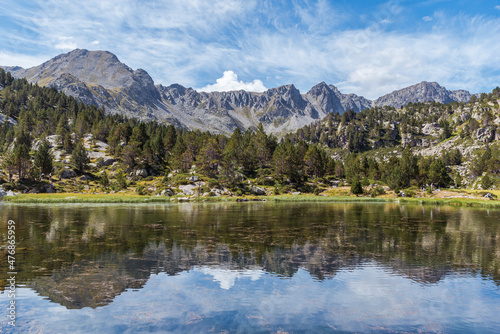 Reflections at the lake in the high mountains. (Circ de Pessons, Andorra, Pyrenees Mountains)
