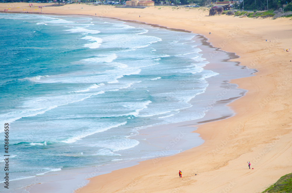 Beautiful ocean waves and sand surface at palm beach view from up the Hill at Barrenjoey headland, Sydney, Australia.