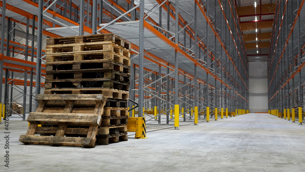 Empty stack pallets in logistics warehouse