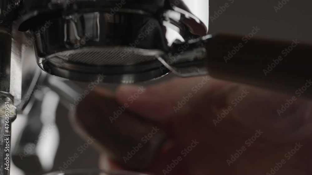 Slow motion pull lever of professional coffee machine with bottomless portafilter Slow motion pull lever of professional coffee machine with bottomless portafilter