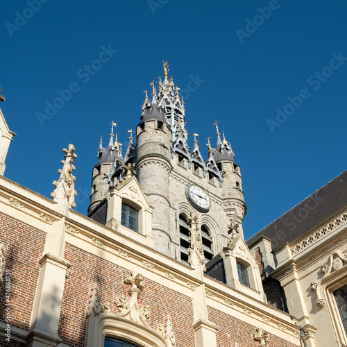 detail of the capitol of Douai, historic tower and facade